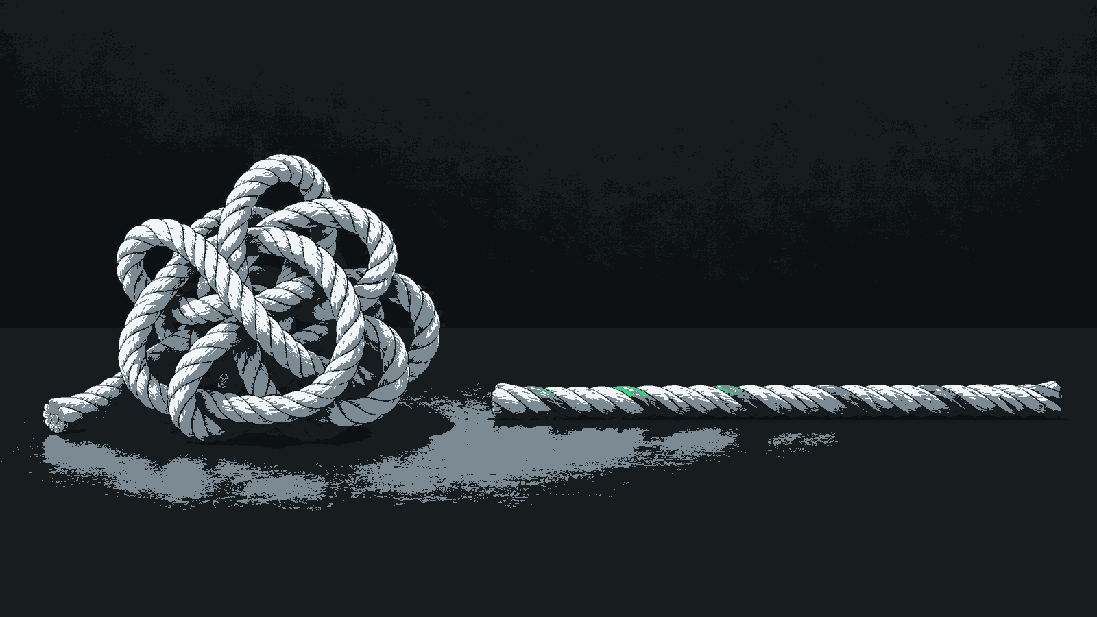 A loose tangled rope sits beside a straight rope with a green accent on a dark surface.